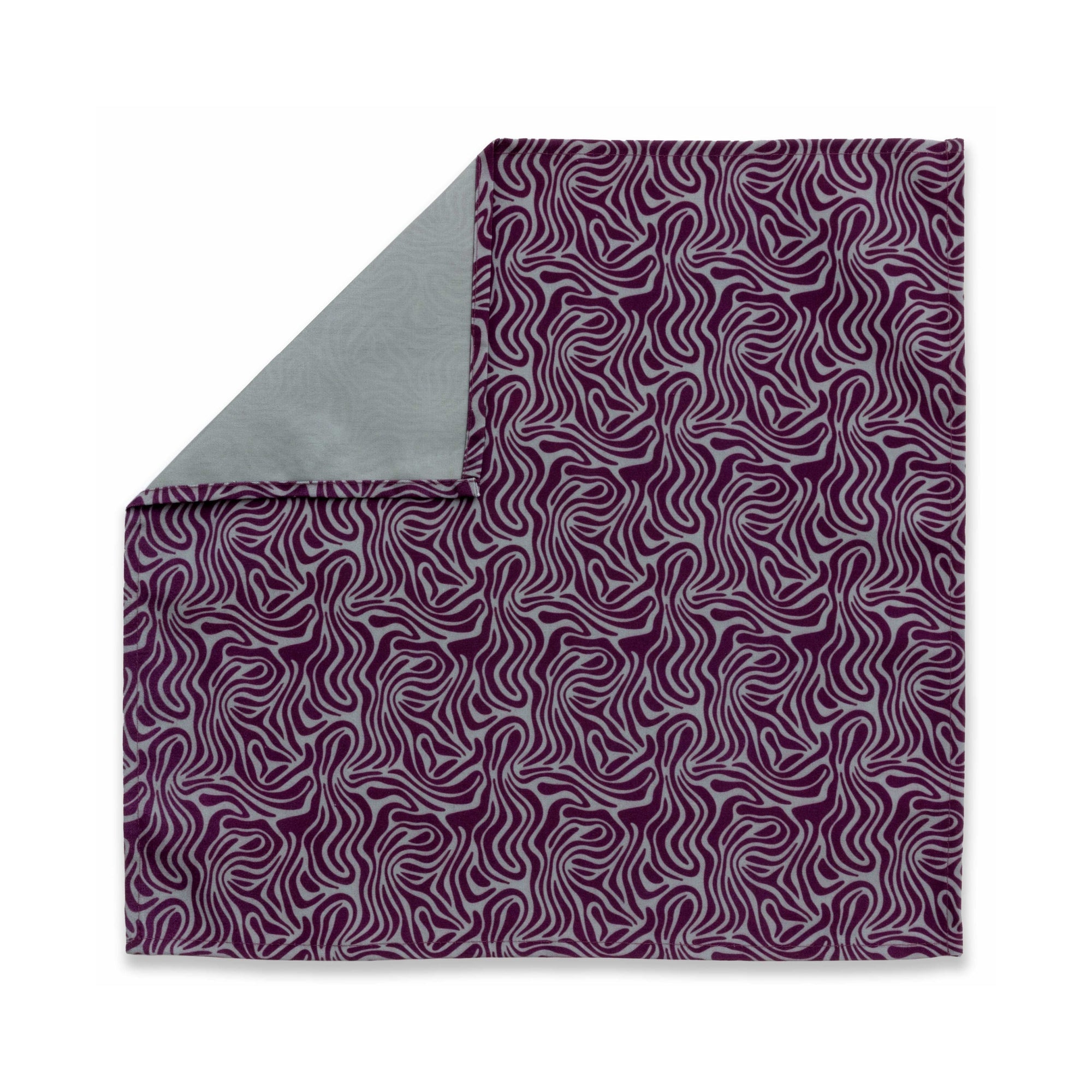 Bright patterned cloth napkin with quarter-inch hem. Base color is stone grey with amorphous layers of dark purple. The back is the base color with small, discreet dark grey logo on bottom left-hand side. View: 6 napkins folded into quarters and fanned out, with pattern side exposed and top left corner folded down to expose back side.