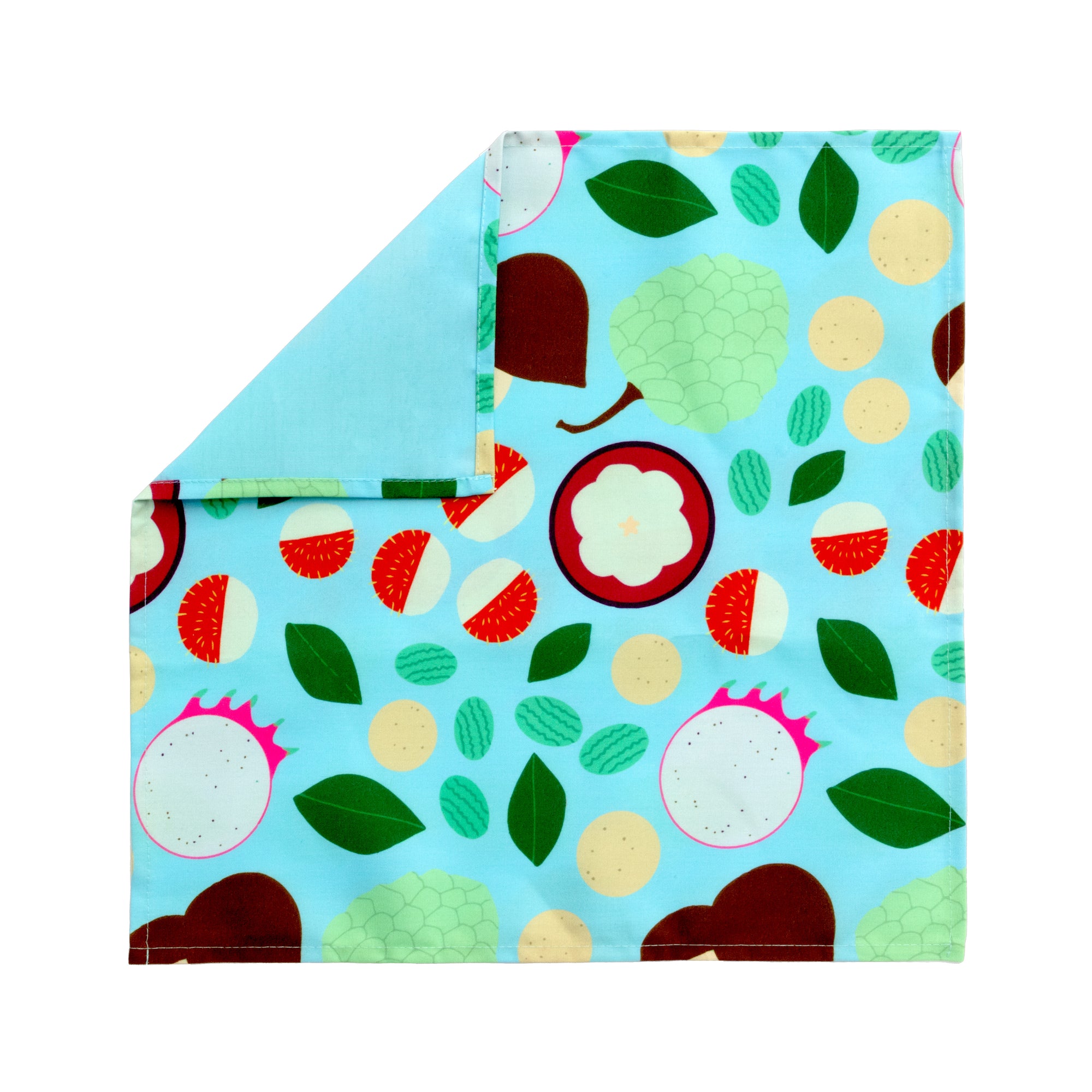 Bright patterned cloth napkin with quarter-inch hem. Base color is swimming pool blue with various multicolored tropical fruits in line-drawing style with colors including but not limited to pistachio green, burnt umber, maroon, forest green, magenta and beige. The back is the base color with small, discreet dark grey logo on bottom left-hand side. View: 1 napkin laid flat, with pattern side exposed and the top left corner folded down to expose back side.