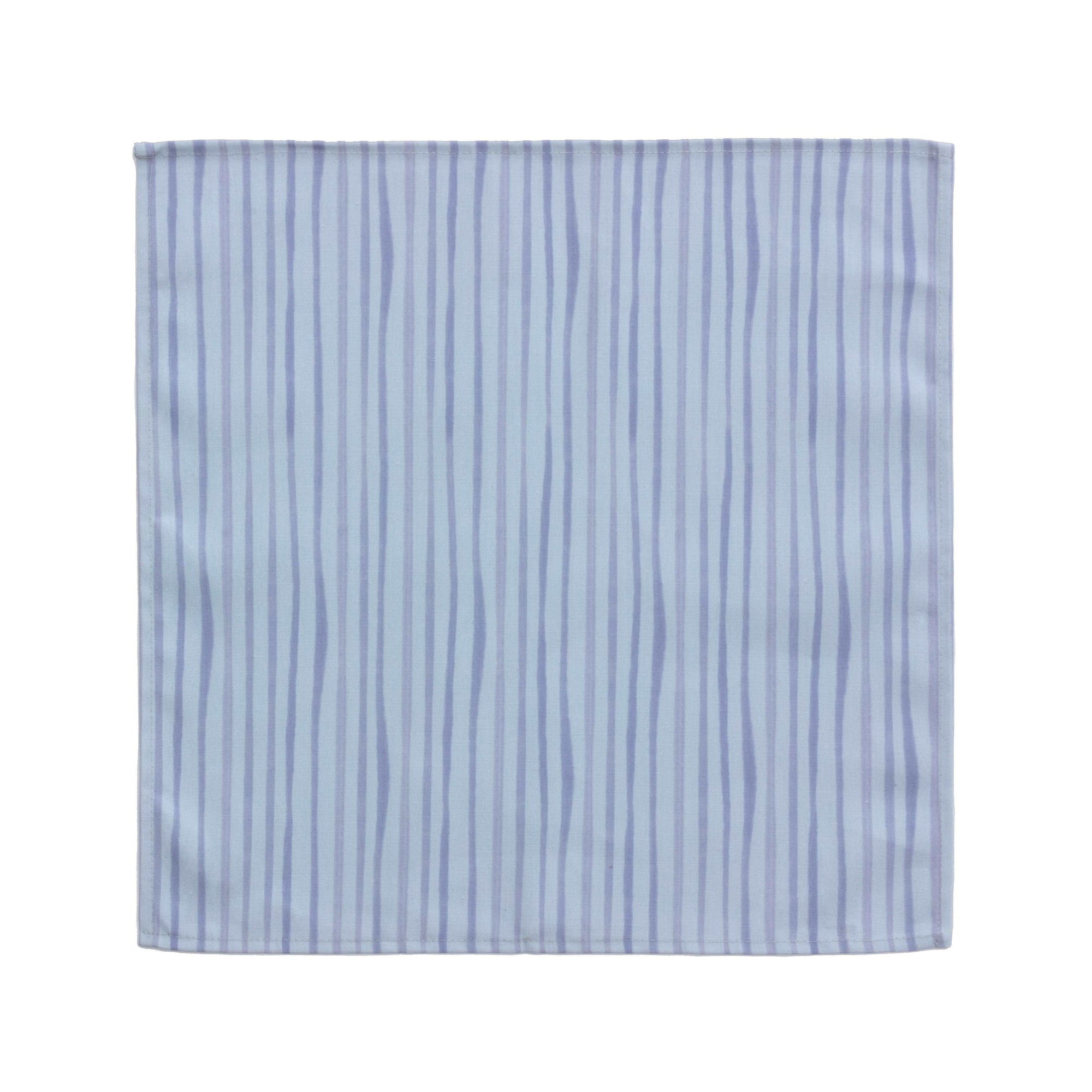 Bright cloth napkin with a pattern of painterly stripes, with quarter-inch hem. Base color is cornflower blue, with alternating stripe of concord purple. The back is the solid base color with small, discreet dark grey logo on bottom left-hand side. View: 1 napkin, laid flat with pattern side exposed.