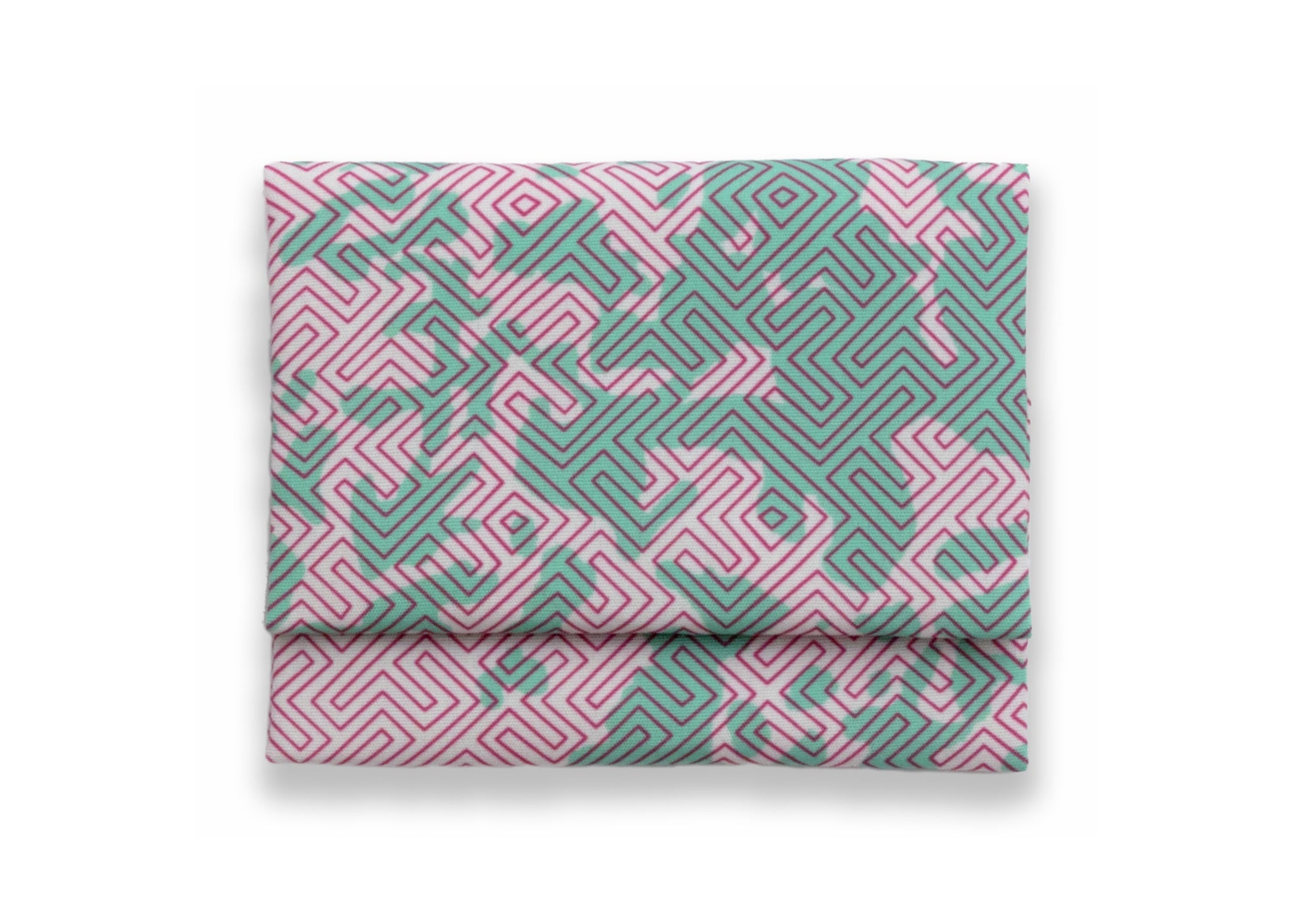 Bright patterned cloth napkin with quarter-inch hem. Base color is pale pink with random splotches of pale mint green, overlaid with a thin-lined, maze-like pattern in raspberry red. The back is the base color with small, discreet dark grey logo on bottom left-hand side. View: 1 napkin folded into a rectangular shape for a table setting, with pattern side exposed.