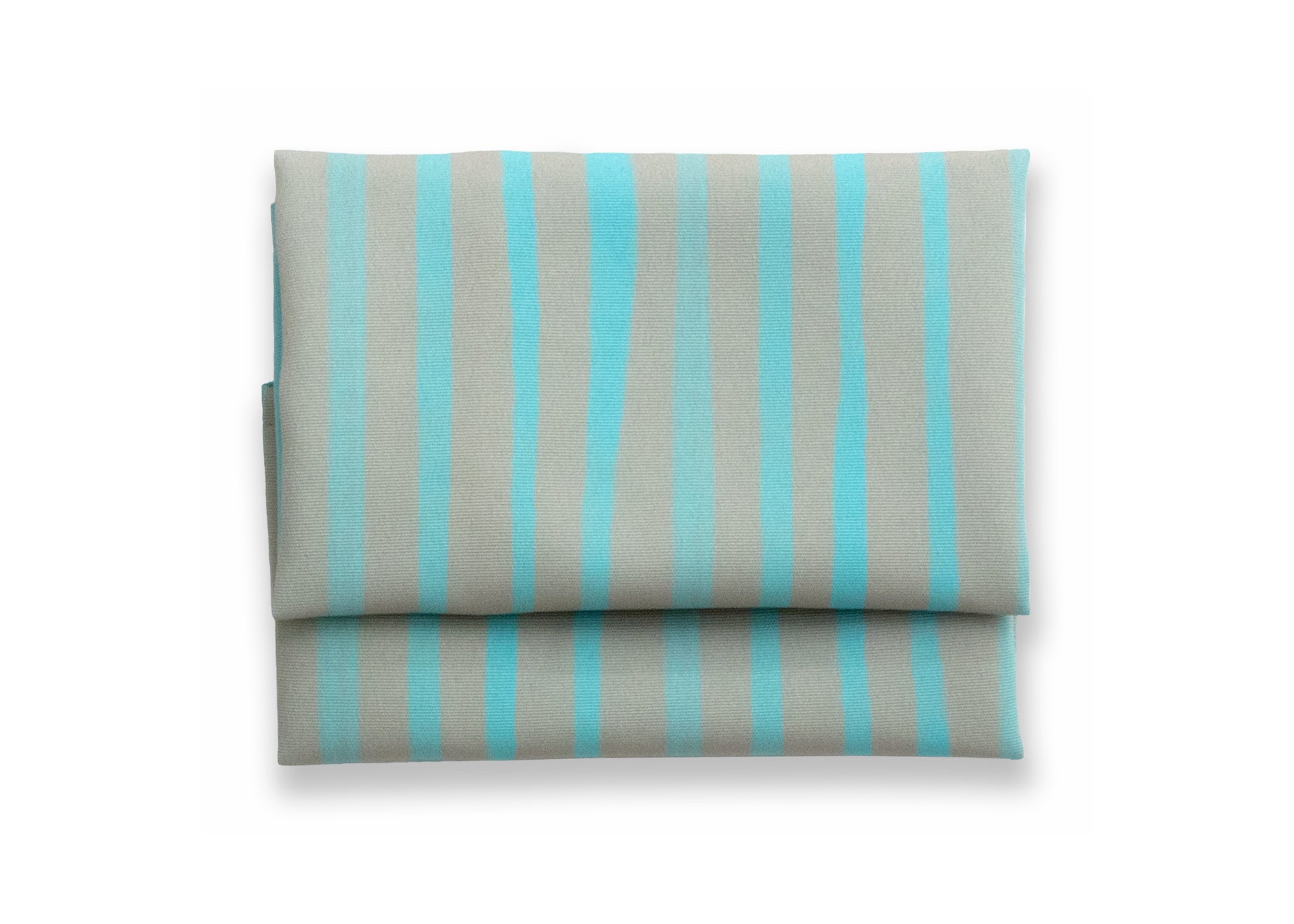 Bright cloth napkin with a pattern of painterly stripes, with quarter-inch hem. Base color is granite grey, with alternating stripe of pastel aquamarine. The back is pastel aquamarine with small, discreet dark grey logo on bottom left-hand side. View: 1 napkin folded into a rectangular shape for a table setting, with pattern side exposed.