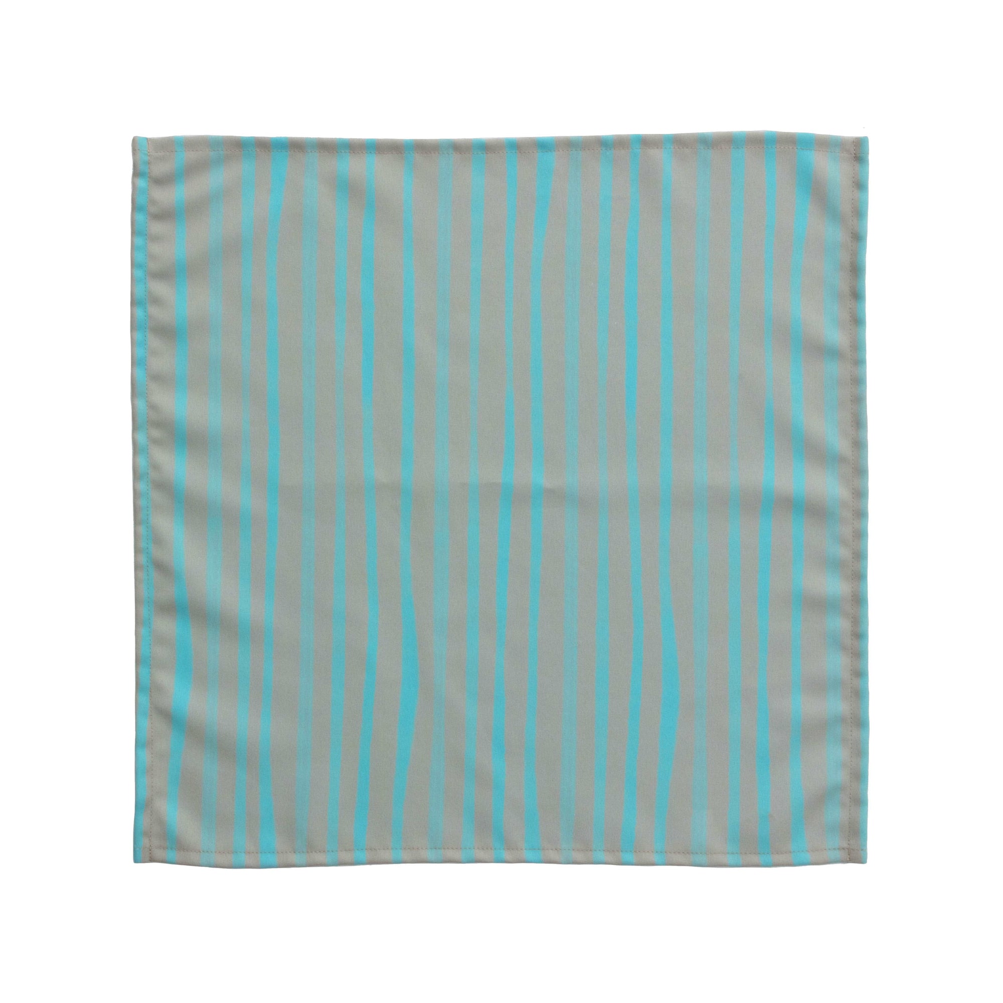 Bright cloth napkin with a pattern of painterly stripes, with quarter-inch hem. Base color is granite grey, with alternating stripe of pastel aquamarine. The back is pastel aquamarine with small, discreet dark grey logo on bottom left-hand side. View: 1 napkin laid flat, with pattern side exposed.