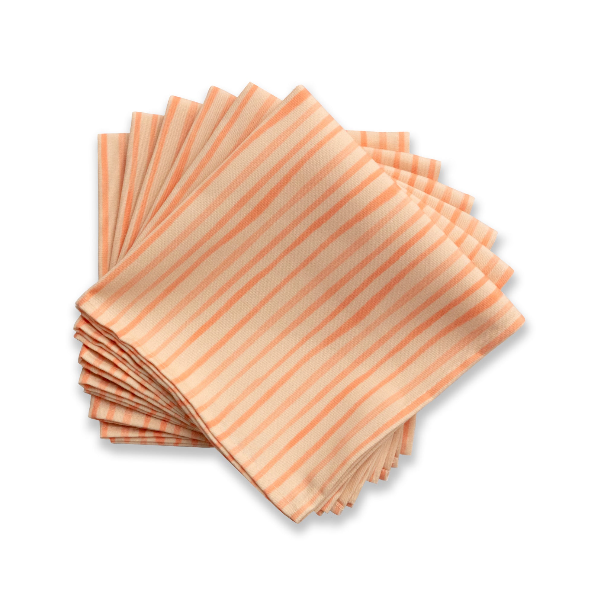 Bright cloth napkin with a pattern of painterly stripes, with quarter-inch hem. Base color is pale apricot with alternating stripe of peach. The back is the base color with small, discreet dark grey logo on bottom left-hand side. View: 6 napkins, folded into quarters and fanned out, with pattern side exposed.