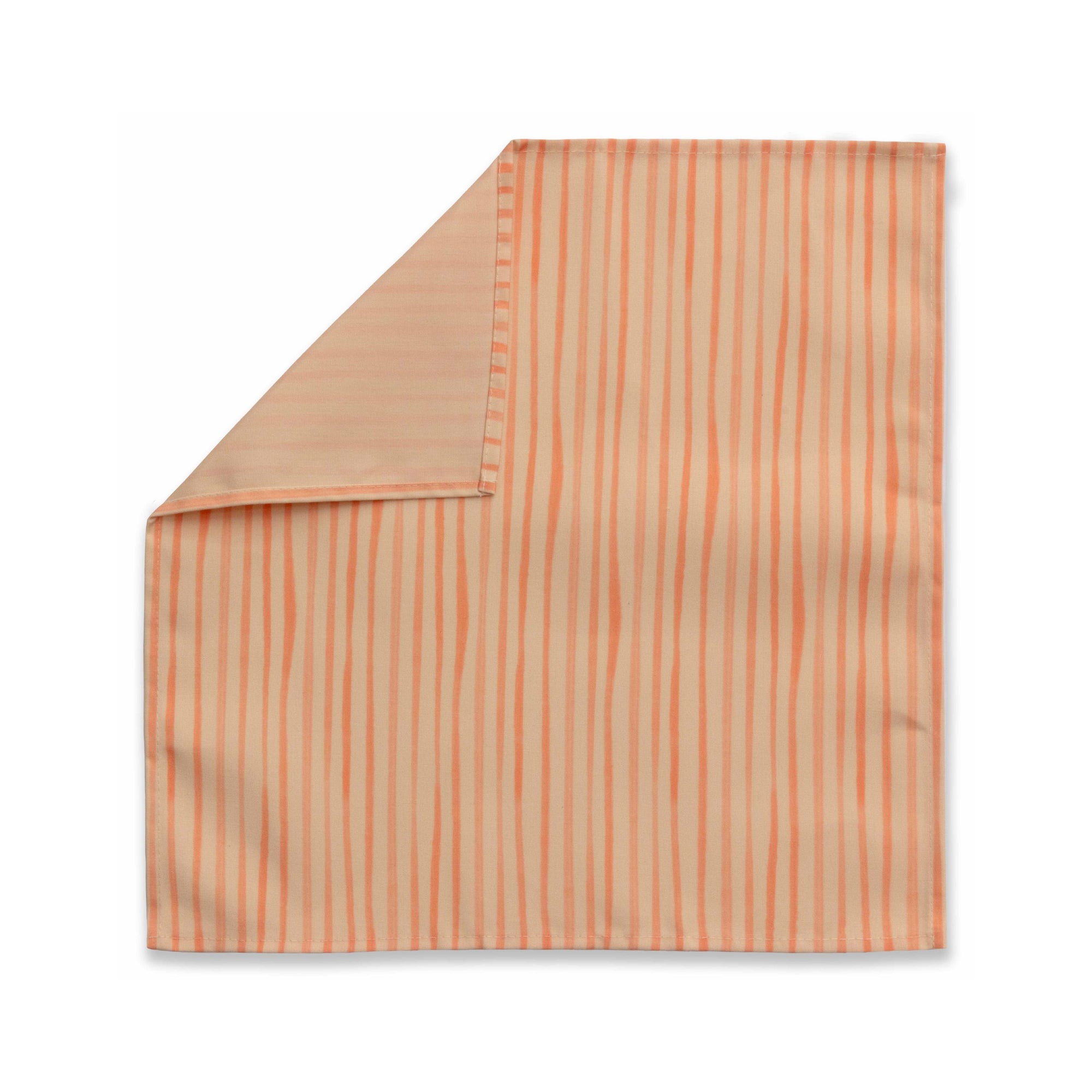 Bright cloth napkin with a pattern of painterly stripes, with quarter-inch hem. Base color is pale apricot with alternating stripe of peach. The back is the base color with small, discreet dark grey logo on bottom left-hand side. View: 1 napkin laid flat, with pattern side exposed and top left corner folded down to expose back side.